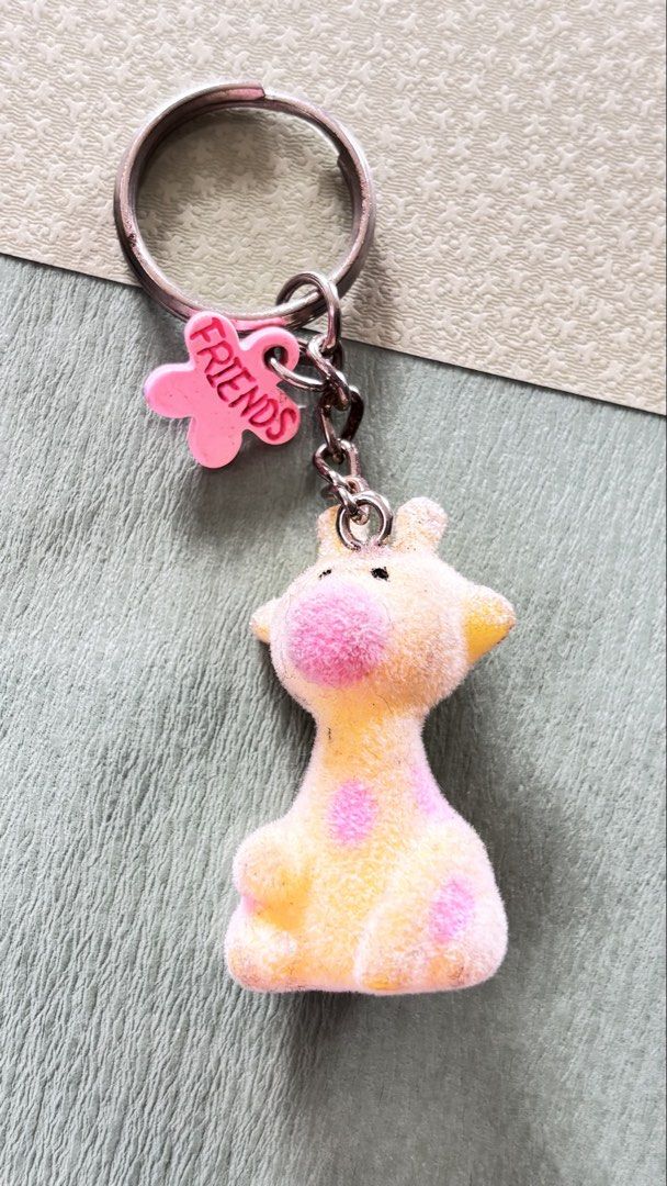Flocky Giraffe keychain (Category: Other Merchandise) located in Calamba. Submitted by cur8d (Listing ID 1467645304, Image 1). Description: with spot dirt.