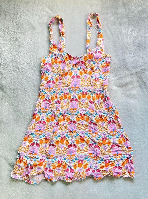 Floral pattern sleeveless mini dress (Category: Dresses) located in Rizal. Submitted by sheeraay (Listing ID 1467660429, Image 2). Description: - Vibrant pink and orange floral all-over print - Sleeveless design with thick straps and flattering sweetheart neckline - Short length (falls right above the knee).