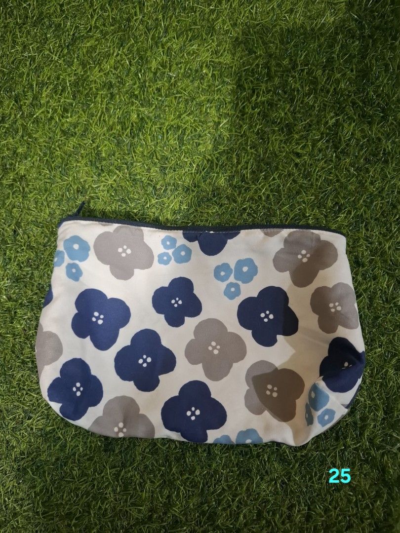 Floral Pouch Cosmetic Bag Makeup Pouch (Category: Purses & Pouches) located in Pasay City. Submitted by emilia1102 (Listing ID 1467799647, Image 1). Description: - Cute floral design (navy, grey, light blue flowers on white) - Secure top zipper closure - Perfect size for makeup, keys, and daily essentials - Fits easily inside your handbag.