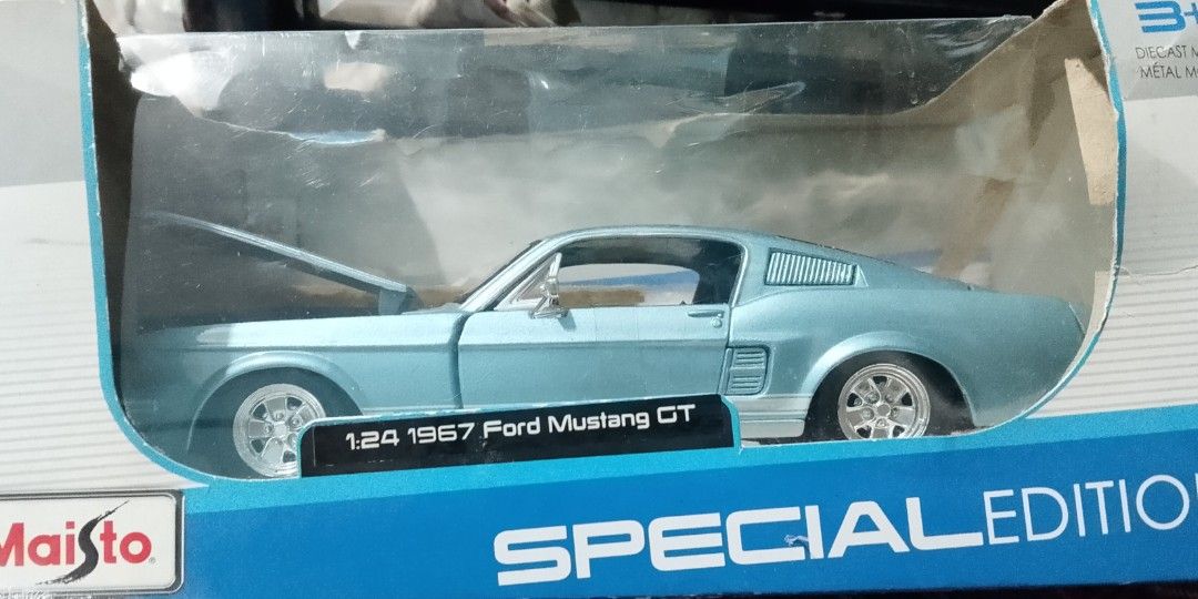 FORD Mustang GT (Category: Vehicle & Diecast Models) located in Manila. Submitted by amomof3at41 (Listing ID 1467671082, Image 1). Description: Ford Mustang G% special edition 1967 1:24 scale maisto blue and silver colorway.