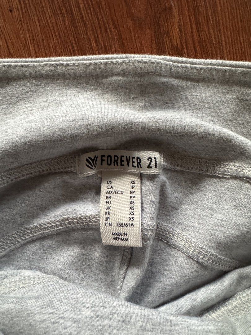 Forever 21 Grey Mesh Panel Leggings (Category: Activewear) located in Manila. Submitted by gemfinderph (Listing ID 1467671188, Image 2). Description: - Brand: Forever 21 - Color: Grey - Size: XS - Material: Comfortable stretch fabric with elastic waistband - Design: Stylish mesh panel inserts along the lower legs.