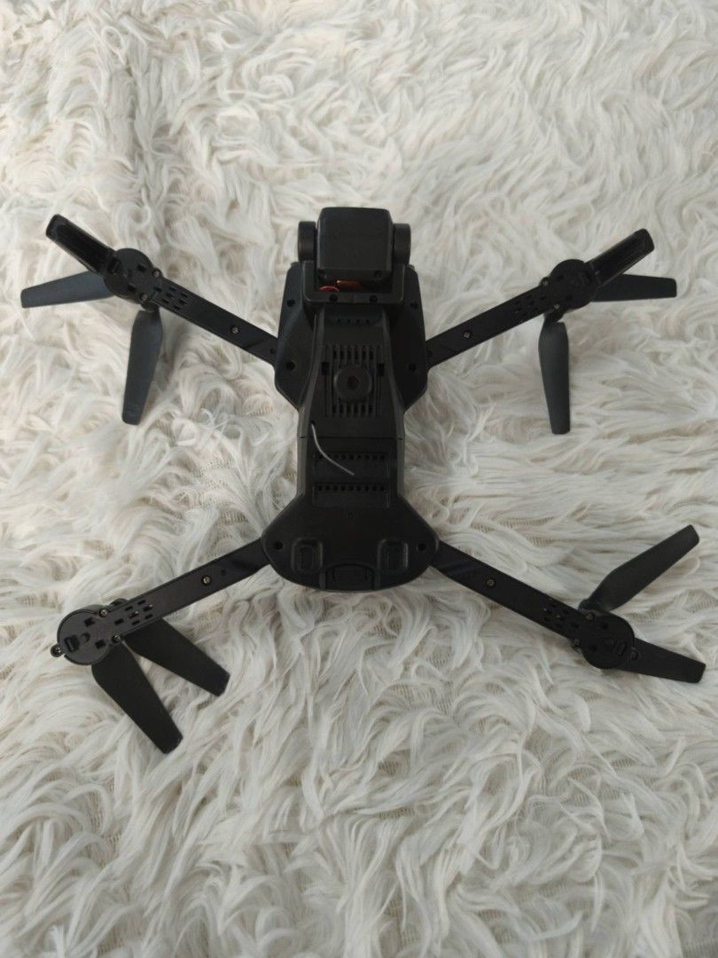 Four axis drone G5 (Category: Drones) located in Baguio. Submitted by gherszelle (Listing ID 1467701777, Image 2). Description: This compact, foldable hobby drone kit comes complete with a carbon-fiber textured remote controller, spare parts, and propeller guards. Everything is neatly organized in a durable, zippered carrying case, making it perfect for portable, on-the-go flying..