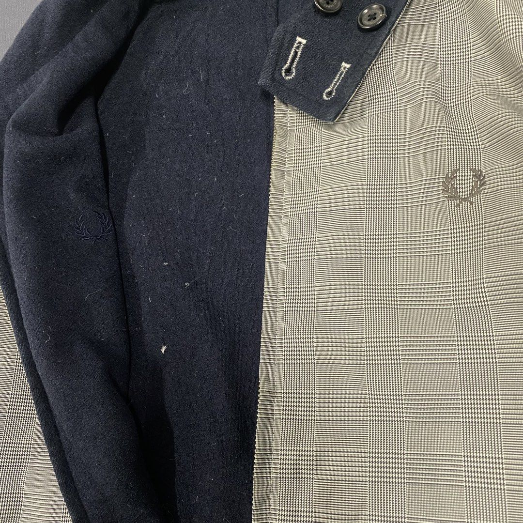 Fred Perry Glen Plaid Reversible Jacket Size S (Category: Coats, Jackets and Outerwear) located in Santa Maria. Submitted by saintarchive316 (Listing ID 1467837454, Image 3). Description: - Brand: Fred Perry - Size: S (Fits chest 86-94 cm, height 165-175 cm) - Design: Reversible 2-in-1 jacket - Side A: Grey glen plaid pattern with front pockets and embroidered laurel wreath logo - Side B: Solid textured dark navy blue - Details: Full zip closure,
