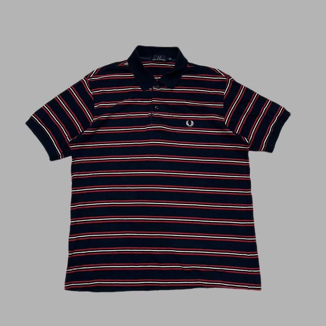 Fred Perry Striped Polo Shirt Navy Red White (Category: Tshirts & Polo Shirts ) located in Manila. Submitted by frenzyyyy (Listing ID 1467627140, Image 1). Description: - Brand: Fred Perry - Color: Navy blue with red and white horizontal stripes - Details: Classic collar, two-button placket with branded buttons, ribbed sleeve cuffs - Logo: White embroidered laurel wreath on left chest - Material: Soft cotton knit - Size: Medium - Dimes: 21/27 - C