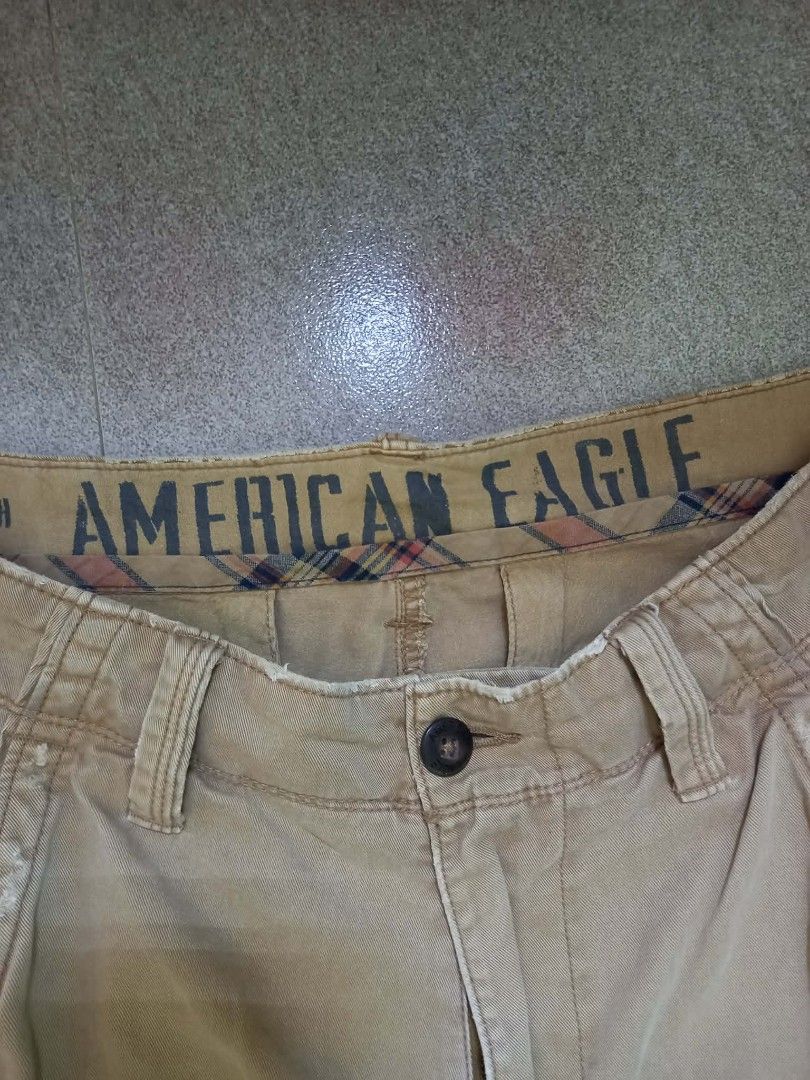 American Eagle Khaki Shorts Size 33 (Category: Shorts) located in Panabo. Submitted by khimmyirish_ki021126 (Listing ID 1467697846, Image 2). Description: - Brand: American Eagle - Size: 33 waist - Color: Khaki - Material: 100% cotton (Made in Bangladesh) - Features: Button fly, front and back pockets, stylish plaid lining inside the waistband - Care: Machine washable - Condition: Pre-loved, well-maintained.