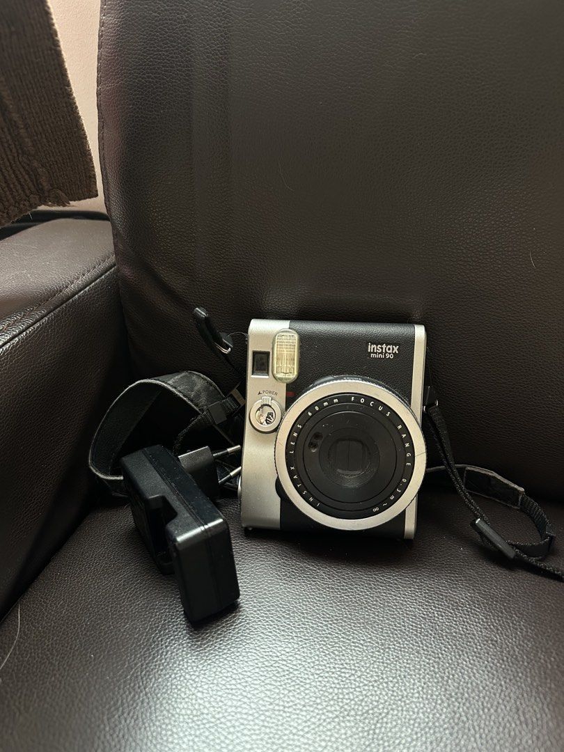 Fujifilm Instax Mini 90 Neo Classic Camera (Category: Cameras) located in Manila. Submitted by kanibear (Listing ID 1467673982, Image 1). Description: Tested and working. INCLUSIONS: - Camera - With strap (but medyo nagbabakbak na siya) - Charger, good as new (matagal battery ng cam na to so i wasn’t really able to use the charger as much - FREE: 5 leftover na film shots sa cam itself NOTE: Has slight scratches and dusts. Body shows minor signs o