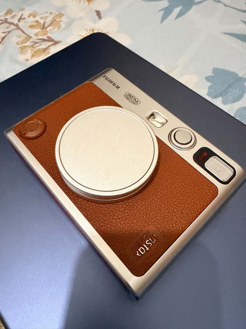 Fujifilm Instax Mini Evo Camera Brown Silver (Category: Cameras) located in Los Banos. Submitted by _bugsssbunny (Listing ID 1467692453, Image 2). Description: Inclusion: 128 GB memory card Clear case Original charger cable Original strap Lens cap.