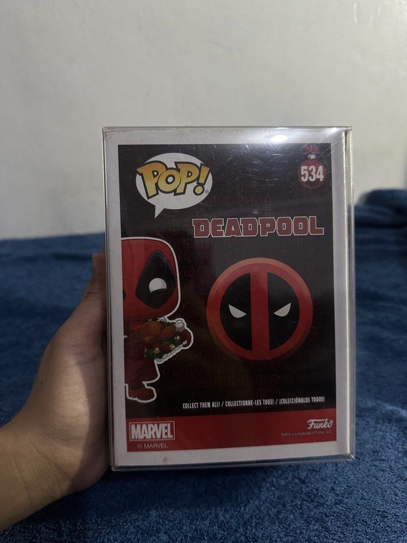 Funko Pop Marvel Deadpool Supper Hero #534 (Category: Designer & Blind Box Toys) located in Cavite. Submitted by kobebean_122 (Listing ID 1467710443, Image 2). Description: - Character: Funko Pop Marvel Deadpool (#534) - Special Feature: Holding a roast turkey platter - Condition: Includes clear plastic protector case - Packaging: Box features vibrant Deadpool graphics on front and back - Perfect for: Marvel collectors and Deadpool fans.
