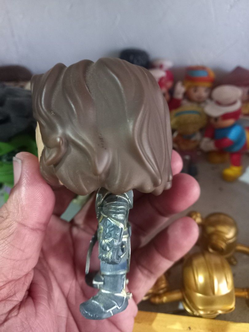 Funko Pop Vinyl Figure War craft Character Lothar (Category: Designer & Blind Box Toys) located in Manila. Submitted by cristobalc40322 (Listing ID 1467688663, Image 2). Description: - Item: Funko Pop Vinyl Collectible Figure - Details: Brown hair, detailed medieval armor, holding a sword - Authenticity: Stamped Funko LLC 2013, made in China (Code: A323) - Style: Standard bobblehead vinyl figurine - Condition: Pre-owned with minor scuffs and pain