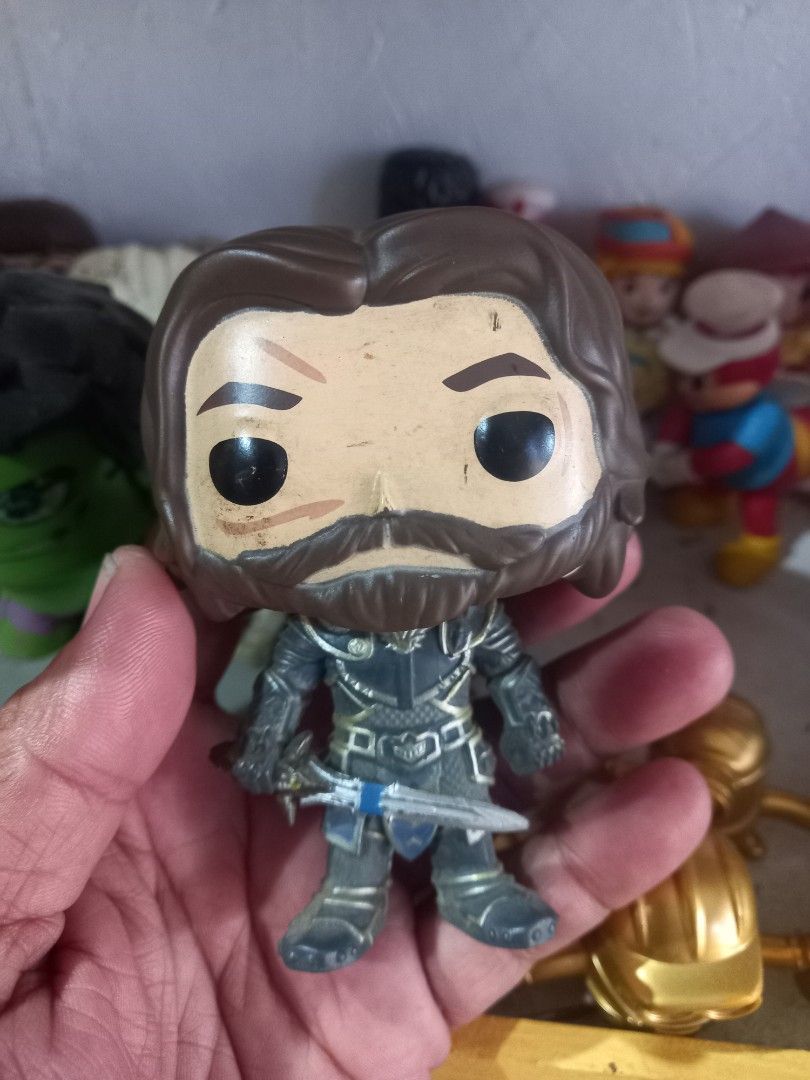 Funko Pop Vinyl Figure War craft Character Lothar (Category: Designer & Blind Box Toys) located in Manila. Submitted by cristobalc40322 (Listing ID 1467688663, Image 1). Description: - Item: Funko Pop Vinyl Collectible Figure - Details: Brown hair, detailed medieval armor, holding a sword - Authenticity: Stamped Funko LLC 2013, made in China (Code: A323) - Style: Standard bobblehead vinyl figurine - Condition: Pre-owned with minor scuffs and pain