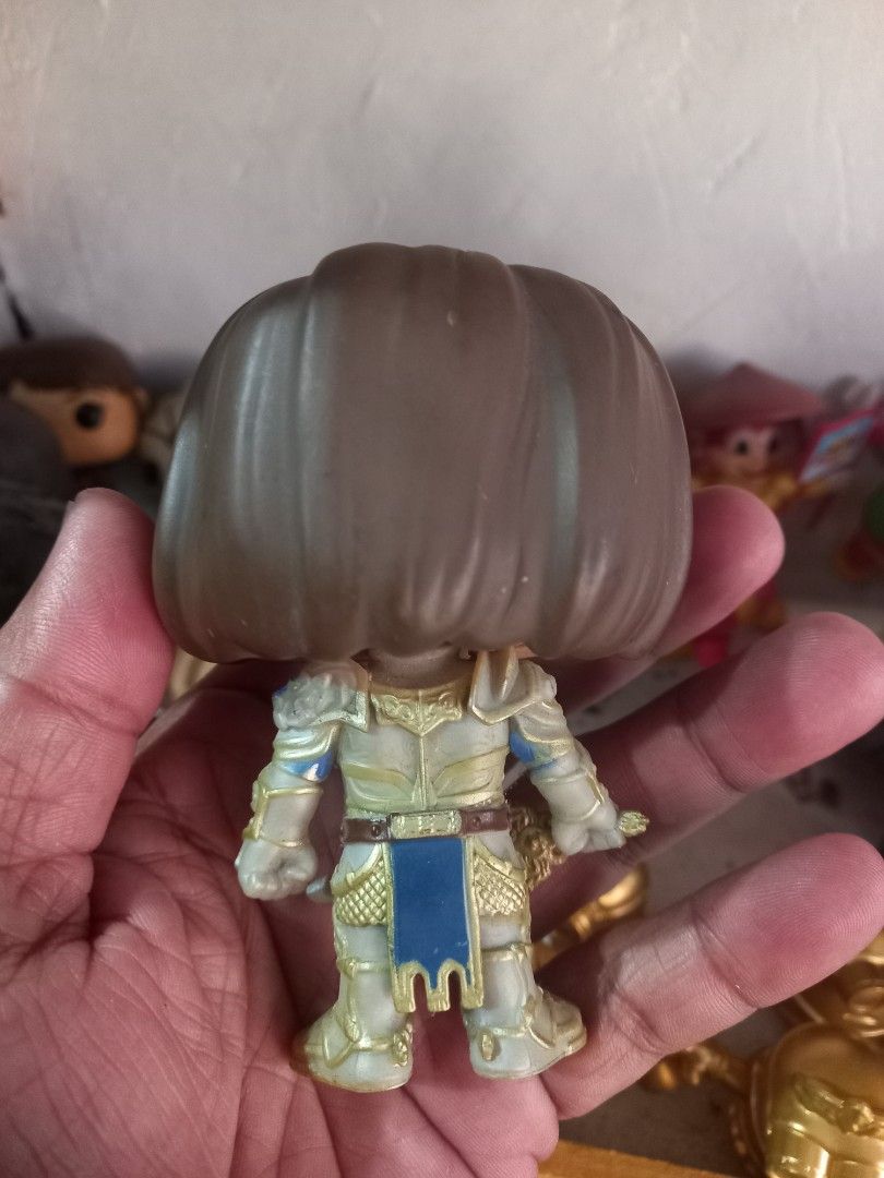Funko Pop War craft King LLANE (Category: Figurines & Statues) located in Manila. Submitted by cristobalc40322 (Listing ID 1467690871, Image 3). Description: - Item: Funko Pop Aragorn Vinyl Figure (The Lord of the Rings) - Details: Wears silver and gold armor with sword in hand; detailed brown hair and beard paintwork - Condition: Loose figure only, no original box, minor dust on the face - Authenticity: Bottom of feet stamped with Funko LLC 2018