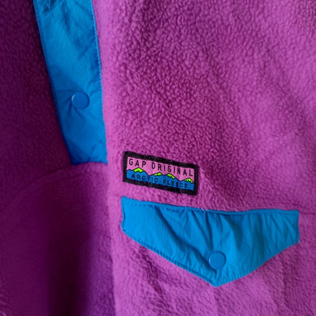 Gap Arctic Fleece Reissue Pullover Fuchsia Shock Size M (Category: Coats, Jackets and Outerwear) located in Manila. Submitted by pdwainn84681 (Listing ID 1467677704, Image 3). Description: - Brand/Style: Gap Arctic Fleece Reissue Pullover - Size: Medium - Color: Fuchsia Shock Purple with Bright Blue contrast trim - Material: Super cozy, textured fleece - Features: Snap placket, stand collar, flap chest pocket - Details: Classic retro mountain gra