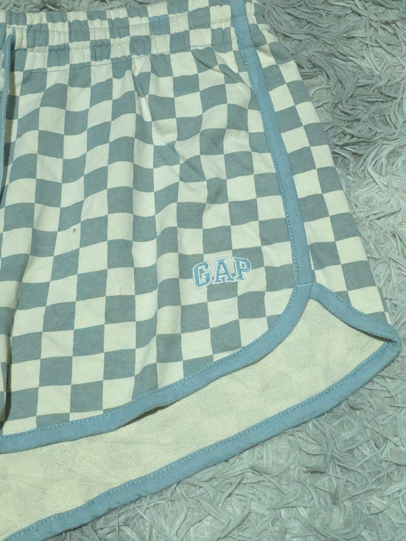Gap Checkered Drawstring Lounge Shorts (Category: Shorts) located in Abulug. Submitted by humanwhosellthings (Listing ID 1467725978, Image 2). Description: - Brand:GAP Womens Short ✅Excellent Condition ✅Issue: needs wash only ▫️Waist Size: 28-34 ▫️Length: 11 - Style: Lounge shorts with blue and off-white checkered pattern - Size: Medium (tag attached) - Material: 77% cotton, 23% polyester blend for ultimate comfort - Features: Elastic waistband w