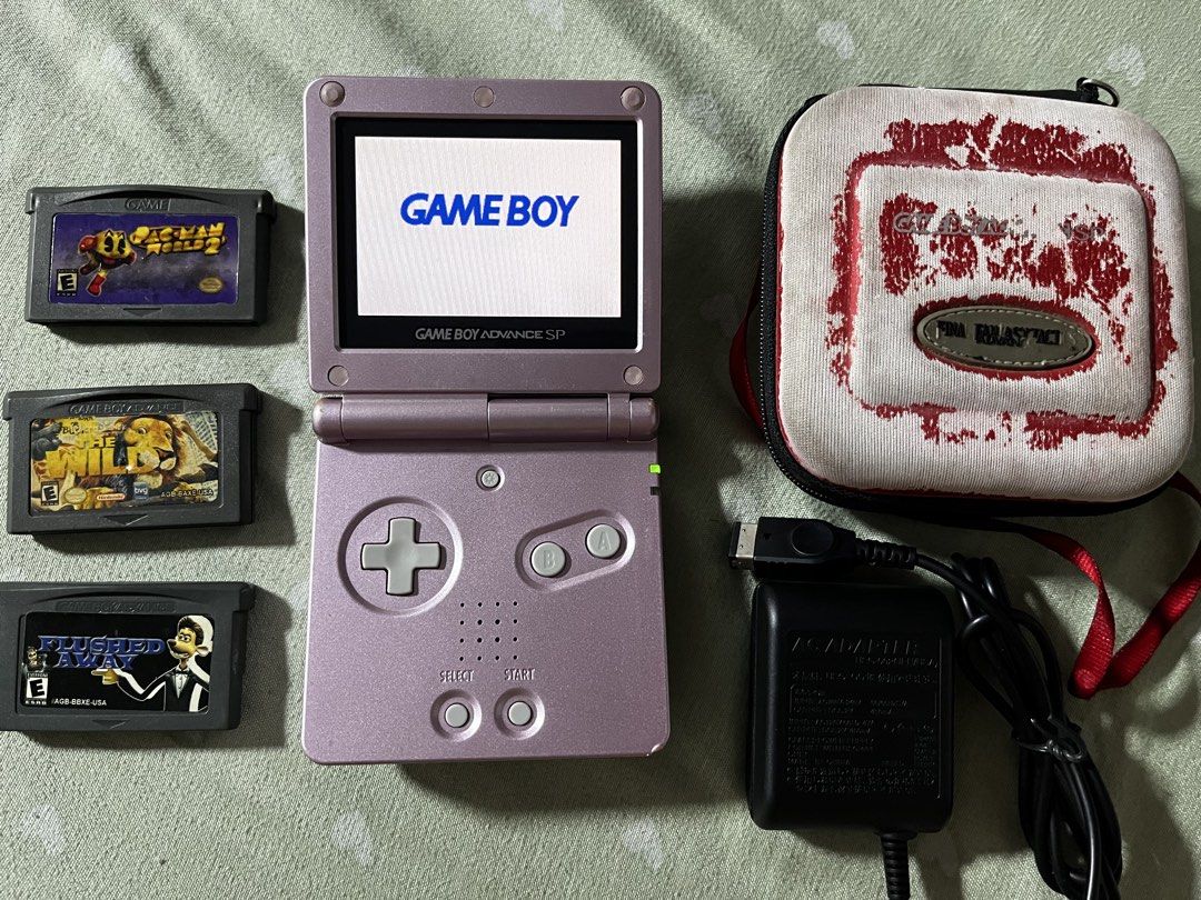 GBA SP AGS-101 Pearl Pink Bundle (Category: Nintendo) located in Marikina City. Submitted by jaydxgamer (Listing ID 1467741623, Image 2). Description: - Model: Nintendo Game Boy Advance SP AGS-101 (Pearl Pink) - Screen: Bright backlit screen, fully functional - Condition: Shell has visible surface scratches from normal use; everything tested and works great - Games included: Pac-Man World 2, The Wild, and Flushed Away - Accessories: AC adapter an