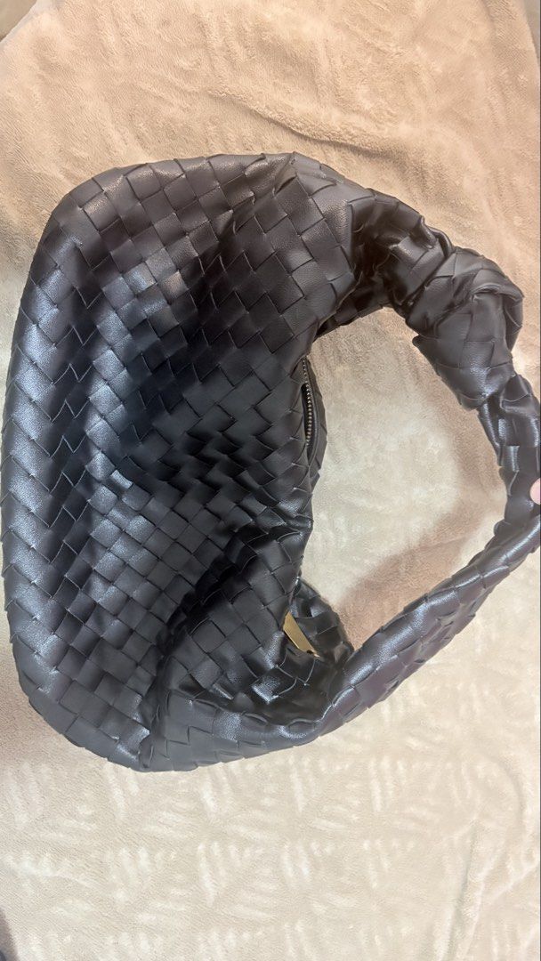 Genuine Leather Woven Shoulder Bag (Category: Shoulder Bags) located in Manila. Submitted by foxychic_mnl (Listing ID 1467626949, Image 1). Description: - Color & Material: Black intrecciato woven leather - Design: Soft, slouchy shape with a stylish knotted top handle - Hardware: Gold-tone hardware with a convenient side zip closure - Interior: Roomy and spacious, fits all your everyday essentials - Condition: Minimal wear, very clean leather ins