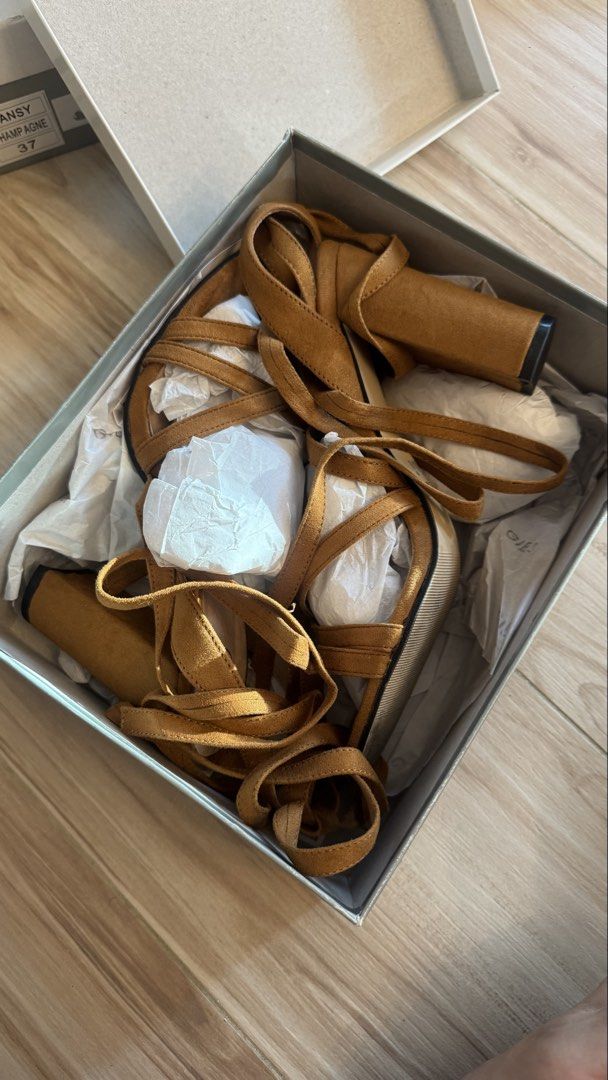 Gibi Galilee Tan Suede Block Heel Sandals Size 38 (Category: Heels) located in Makati City. Submitted by declutter_forsale (Listing ID 1467690804, Image 1). Description: - Brand: Gibi (Model: Galilee) - Color/Material: Tan suede - Size: 38 - Style: Chunky block heel with strappy wrap-around ankle ties - Condition: Brand new, never worn outside (only minor sole wear from indoor try-ons) - Inclusion: Original box included.