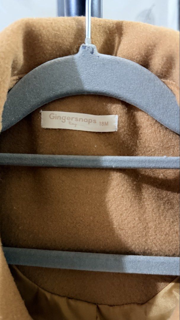 Gingersnaps Tiny Brown Coat 18M (Category: Babies & Kids Fashion) located in Paranaque City. Submitted by paupreloveditems (Listing ID 1467661564, Image 3). Description: - Brand: Gingersnaps - Size: 18 Months - Color: Brown - Design: Scalloped collar with front button closures and two front patch pockets - Interior: Fully lined for extra warmth - Condition: Excellent pre-loved condition - Perfect layering piece for stylish little ones.