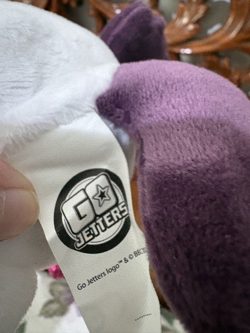 Go Jetters Unicorn Plush Toy (Category: Plushies & Soft Toys) located in Quezon City. Submitted by rxyel (Listing ID 1467659282, Image 3). Description: - Official Go Jetters unicorn plush toy with authentic BBC tag - Features a white body with a cute blue star pattern - Sparkly gold horn and shiny pink hooves/muzzle details - Vibrant purple mane on the back - Clean fabric and soft stuffing, very well-maintained.