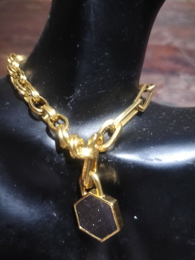 Gold chain necklace with hexagonal black charm pendant (Category: Bracelets) located in Manila. Submitted by patriciab12636 (Listing ID 1467717828, Image 2). Description: Missoma brand gold plated brass - Gold-tone chain necklace with trendy mixed link styles - Features a striking hexagonal pendant with a dark textured stone face - Secure clasp closure - Great statement piece to elevate your daily outfits.