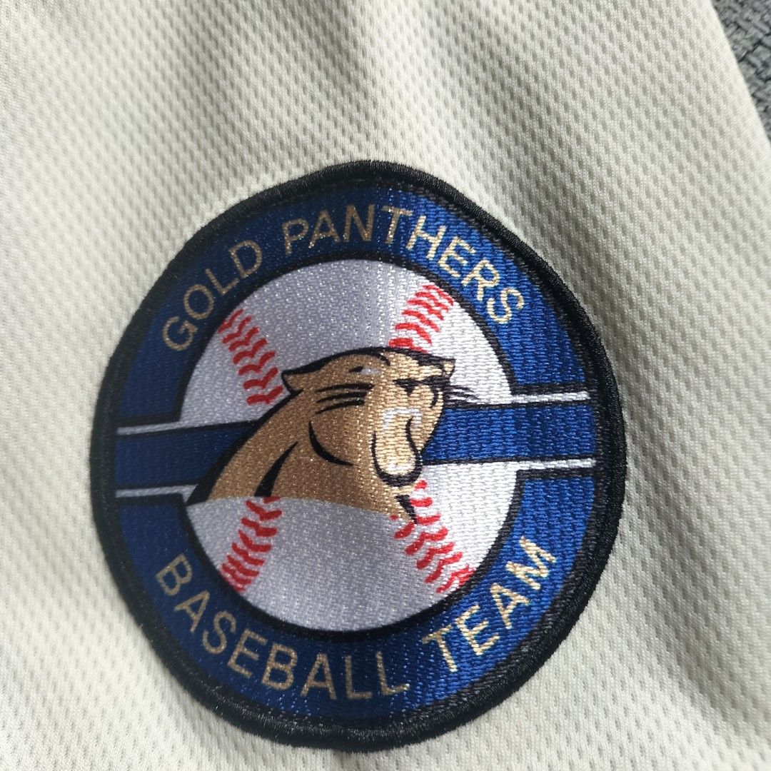 Gold Panthers Baseball Team Jersey Off-White Size 105 (Category: Activewear) located in Taytay. Submitted by calmtree-6248 (Listing ID 1467638424, Image 2). Description: - Style: Off-white Gold Panthers baseball jersey with button-down front - Number: 88 on the front - Details: Embroidered team logo patch on the sleeve - Cuffs: Blue and white sleeve cuffs - Size: 105 tag attached - Material: Breathable mesh fabric - Length: Approximately 29 to 32