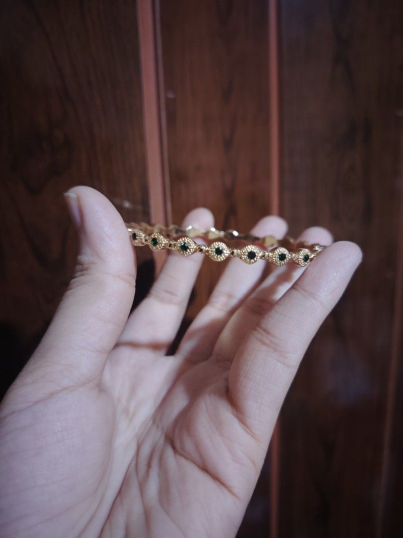 Gold plated Bangle Bracelet with Emerald (Category: Bracelets) located in Caloocan City. Submitted by cherishedfinds (Listing ID 1467715127, Image 1). Description: - Lab Emerald - Gold-plated bangle with intricate textured metalworld - Fit: Slim profile, lightweight, easy to slip on (for reference, I'm 55mm in bangles) - Spend 500, get a freebie 🎁 You may add items from my other listings 💯.