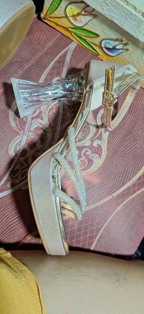 Gold Rhinestone Platform High Heels with Clear Block Heel (Category: Heels) located in Manila. Submitted by c4rtlene (Listing ID 1467737644, Image 2). Description: - Style: Rose gold platform high heels with metallic gold insole - Details: Stunning rhinestone-studded crisscross straps and a modern clear chunky block heel - Fit: Adjustable buckle ankle strap for a secure and comfortable fit - Occasion: Ideal for parties, dinners, night outs, and f