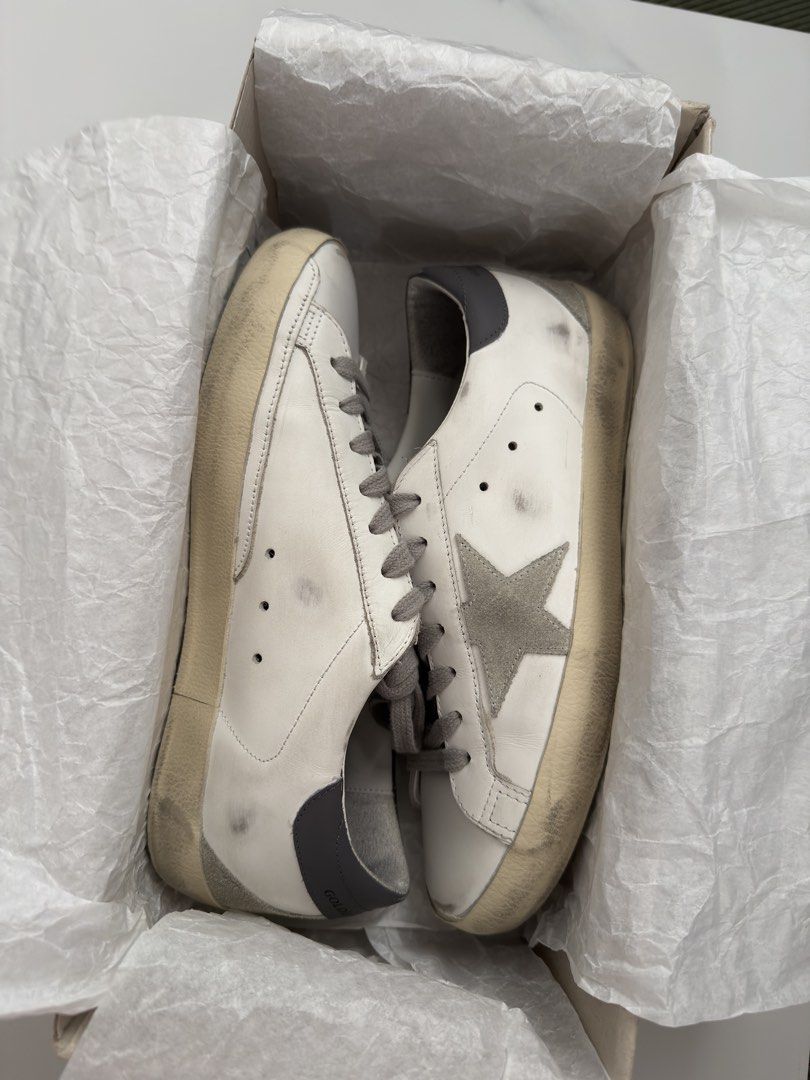 Golden Goose Super-Star White Grey tab - COMPLETE/FULL SET (Category: Sneakers) located in Los Banos. Submitted by jellybeeeans (Listing ID 1467651259, Image 1). Description: Size 39eu Authentic with store receipt! bought it for 699,999 KRW or 32,xxx Php Worn once! Fits 8-9US wmns Comes complete—with box, dustbag, passport, receipt and paper bag Rfs: not my size, getting a bigger pair.
