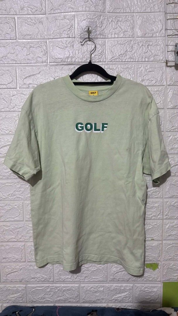 Golf Wang Green GOLF Logo T-Shirt Medium (Category: Tshirts & Polo Shirts ) located in Manila. Submitted by grandwater.53a8ce (Listing ID 1467667490, Image 1). Description: Green Golf Wang tee with white and green GOLF logo across the chest. Size medium tag inside the collar, made of 100% cotton in Vietnam. Machine wash cold, hang dry instructions on the inner yellow tag. Standard crew neck short sleeve streetwear piece from Tyler the Creator's b