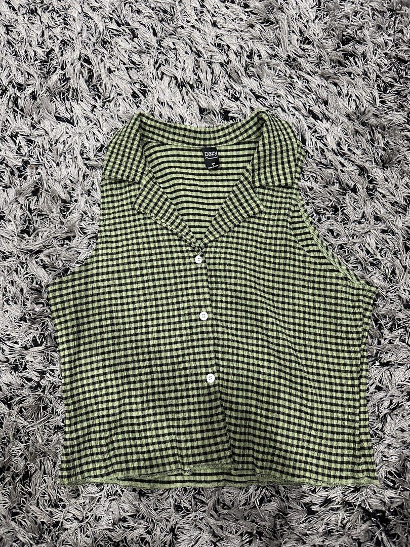 green sleeveless button up (Category: Sleeveless) located in Marikina City. Submitted by bxllaxox (Listing ID 1467751284, Image 1). Description: -buyer must shoulder the shipping.