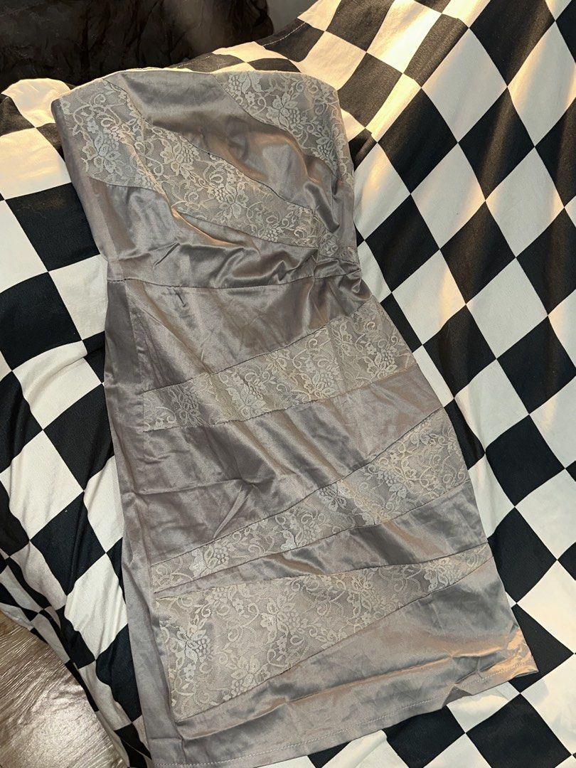 Grey strapless dress with lace insert panels (Category: Dresses) located in Manila. Submitted by tenshiii185 (Listing ID 1467681328, Image 1). Description: - Style: Strapless mini dress - Color/Fabric: Grey satin with alternating solid satin and floral lace diagonal panels - Fit: Structured silhouette with a defined waist seam - Comfort: Smooth lining on the inside - Closure: Secure back zipper.