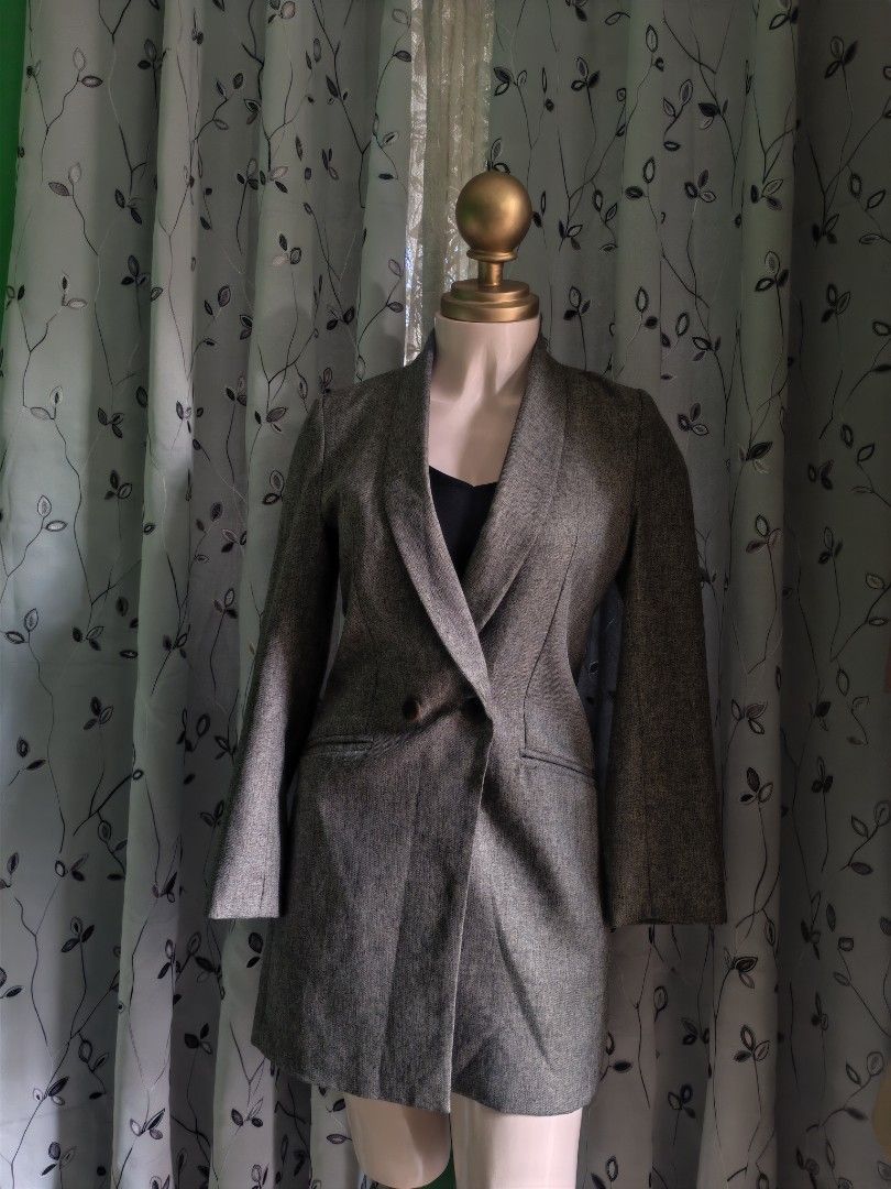 Grey tweed long blazer jacket with shawl collar (Category: Coats, Jackets and Outerwear) located in Caloocan City. Submitted by _misskaye (Listing ID 1467604465, Image 1). Description: - Style: Grey tweed long blazer with a structured waist - Details: Shawl collar neckline, double-breasted front with two brown buttons - Pockets: Two functional side welt pockets - Length: Hits around mid-thigh - Condition: Excellent pre-loved condition.
