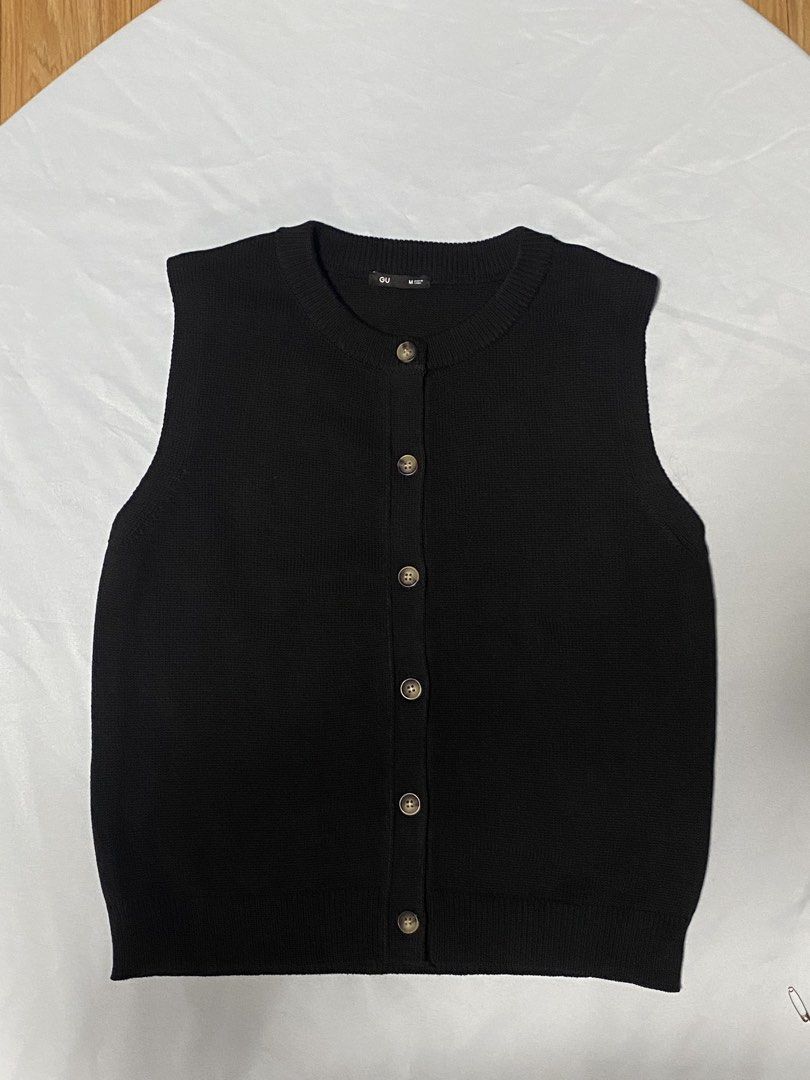 GU Black Knit Button Up Vest Size M (Category: Sleeveless) located in Paranaque City. Submitted by pomeloluvr (Listing ID 1467678678, Image 1). Description: - Brand: GU - Style: Black knit button-up vest - Size: M (tag attached) - Material: 65% polyester, 30% rayon, 5% nylon - Details: Marbled front buttons, ribbed crewneck hem - Condition: Clean, brand new with tag.