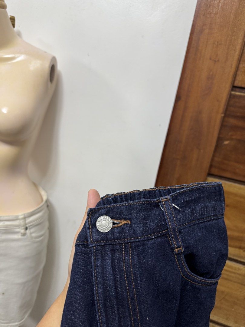 GU Denim Jeans Size M 150 (Category: Jeans) located in Cavite. Submitted by yakultjeni85475 (Listing ID 1467713846, Image 3). Description: - Brand: GU - Color: Dark blue denim - Size: M 150 - Material: 100% cotton (with recycled fibers) - Waistband: Elastic in the back with belt loops - Closure: Front button - Pockets: Two back pockets - Details: Stylish contrast stitching throughout.