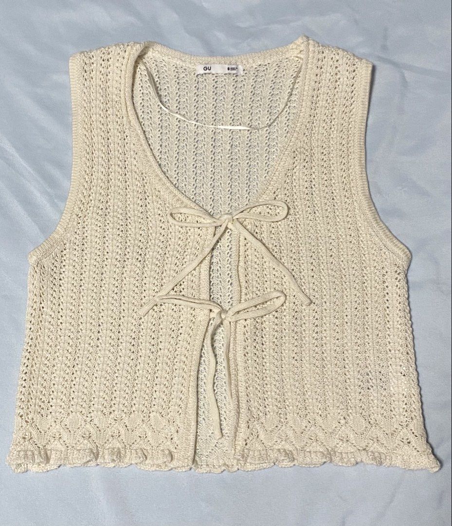 GU Knit Bow Front Tank Top Cream Size S (Category: Sleeveless) located in Paranaque City. Submitted by pomeloluvr (Listing ID 1467677962, Image 1). Description: Cream crochet knit vest by GU. Size S. Front tie ribbon closure with two bows. Open knit pattern with scalloped hem. 100% acrylic material. Lightweightx layering piece for warmer weather or over t-shirts..