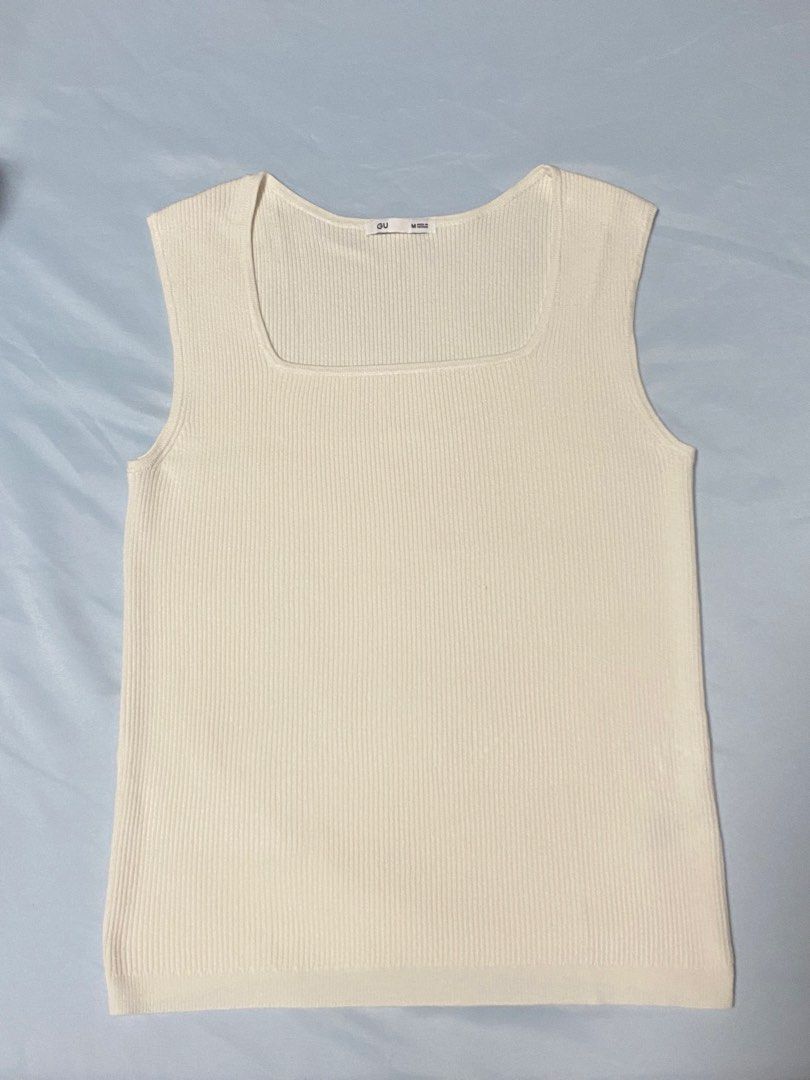GU Square Neck Ribbed Tank Top White Size M (Category: Sleeveless) located in Paranaque City. Submitted by pomeloluvr (Listing ID 1467678075, Image 2). Description: - Brand: GU - Style: Square neck ribbed tank top - Color: Off-white - Size: M (Made in Vietnam) - Material: 78% rayon, 22% nylon - Condition: Clean and well-maintained - Features: Classic sleeveless knit with vertical ribbing, perfect for layering or warm days.
