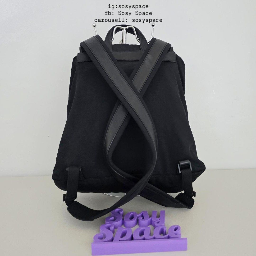 GUCCI Black Backpack (Category: Luxury Bags & Wallets) located in Lucena. Submitted by sosyspace (Listing ID 1467607752, Image 2). Description: G. U. C. C. I. 05B1P171 Durable black nylon with leather backpack Drawstring closure inner main compartment with Flap with snap button top frontal closure Two angled front zippered compartments With interior zippered pocket Mid-sized everyday functional rucksack 32x13x36 cm Condition: PRELOVED minor signs