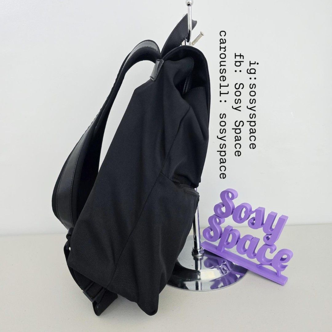 GUCCI Black Backpack (Category: Luxury Bags & Wallets) located in Lucena. Submitted by sosyspace (Listing ID 1467607752, Image 3). Description: G. U. C. C. I. 05B1P171 Durable black nylon with leather backpack Drawstring closure inner main compartment with Flap with snap button top frontal closure Two angled front zippered compartments With interior zippered pocket Mid-sized everyday functional rucksack 32x13x36 cm Condition: PRELOVED minor signs