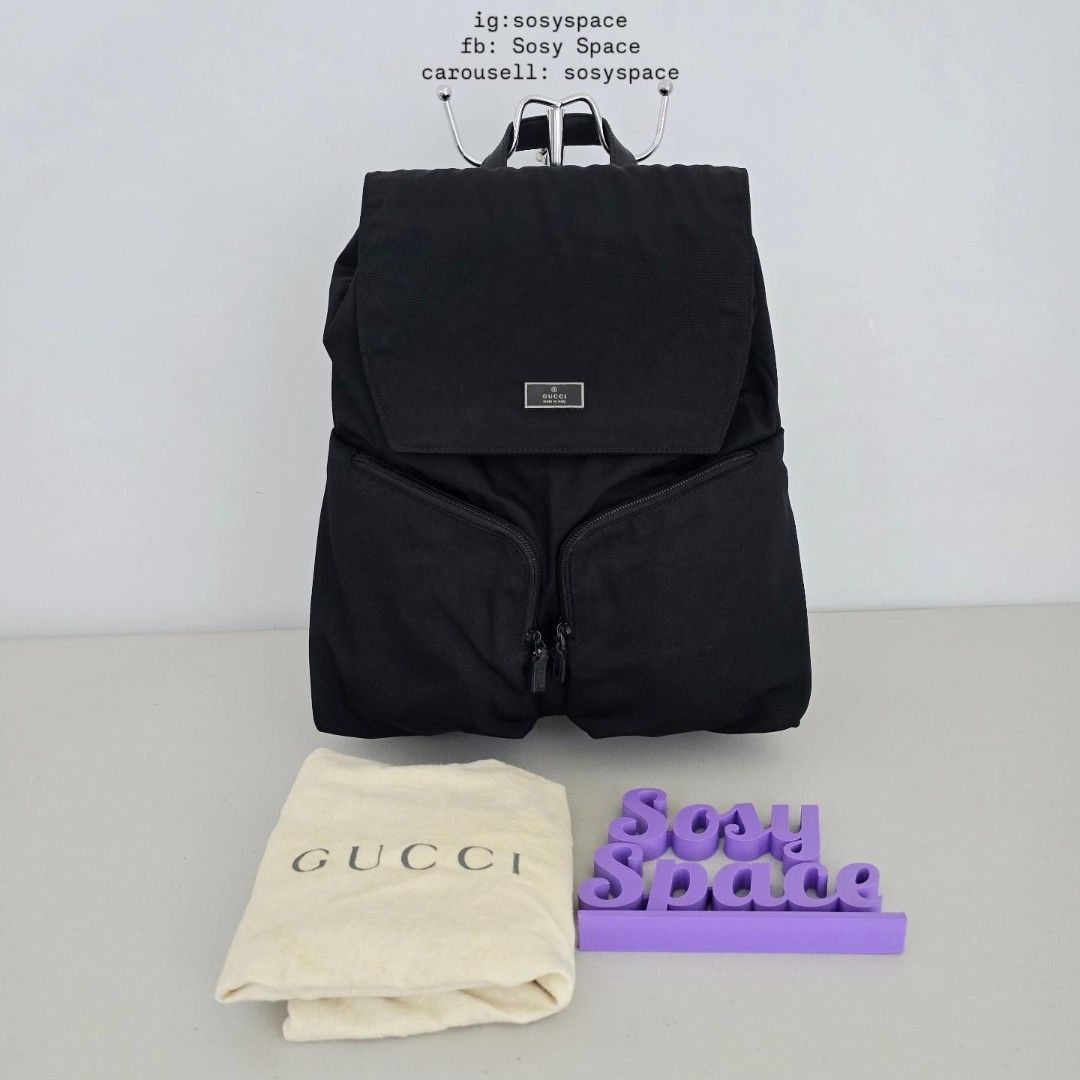 GUCCI Black Backpack (Category: Luxury Bags & Wallets) located in Lucena. Submitted by sosyspace (Listing ID 1467607752, Image 1). Description: G. U. C. C. I. 05B1P171 Durable black nylon with leather backpack Drawstring closure inner main compartment with Flap with snap button top frontal closure Two angled front zippered compartments With interior zippered pocket Mid-sized everyday functional rucksack 32x13x36 cm Condition: PRELOVED minor signs
