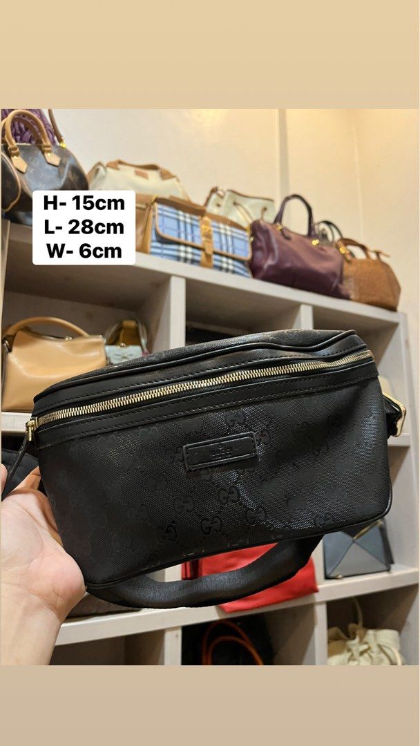 Gucci Black GG Monogram Belt Bag (Category: Luxury Bags & Wallets) located in Bacolod City. Submitted by vintage_vogue6100 (Listing ID 1467762894, Image 1). Description: - Brand: Gucci - Color: Black with all-over monogram pattern - Dimensions: 28cm x 15cm x 6cm - Hardware: Gold-toned with engraved branding on buckle and zipper - Strap: Adjustable nylon strap with metal slider - Details: Leather brand patch on the front.