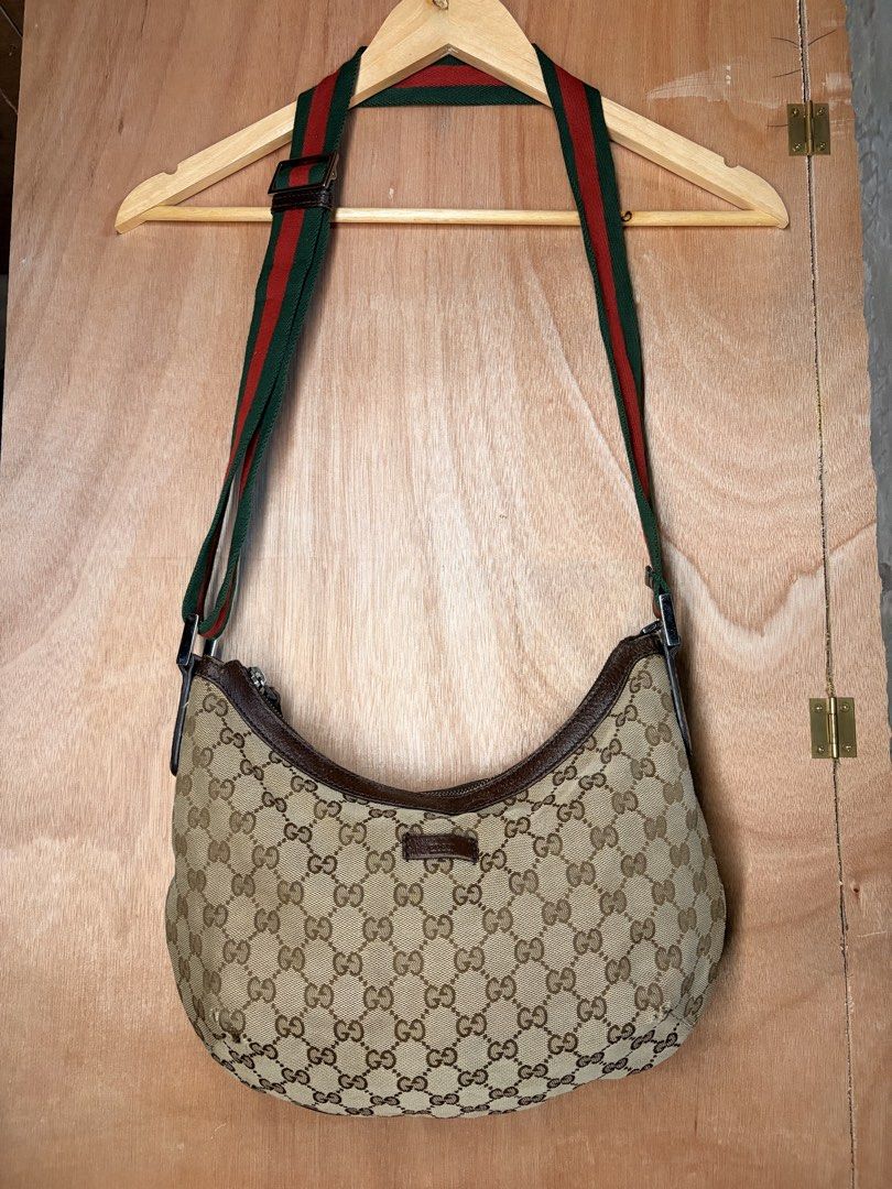 Gucci GG Canvas Web Half Moon Shoulder Bag c. 2000s (Category: Luxury Bags & Wallets) located in Butuan. Submitted by jdsthrift_22 (Listing ID 1467717396, Image 1). Description: In good condition Issue see photos Dimensions to be follow More photos or details please pm.