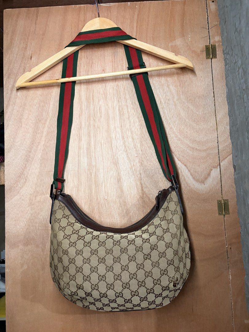 Gucci GG Canvas Web Half Moon Shoulder Bag c. 2000s (Category: Luxury Bags & Wallets) located in Butuan. Submitted by jdsthrift_22 (Listing ID 1467717396, Image 2). Description: In good condition Issue see photos Dimensions to be follow More photos or details please pm.