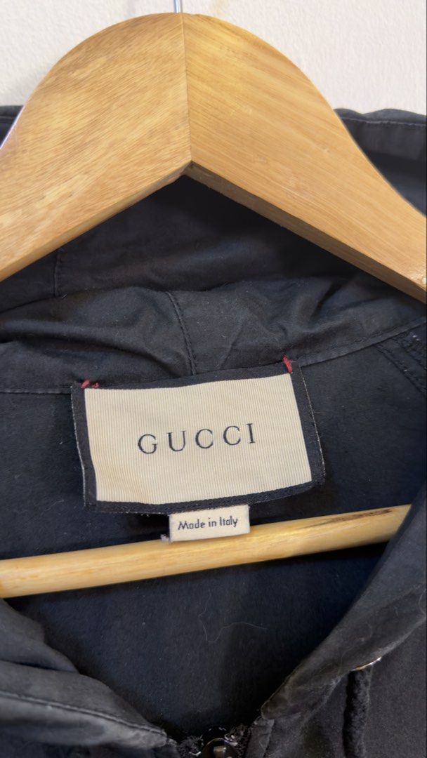 Gucci Hooded Anorak Jacket Black Size 46 (Category: Coats, Jackets and Outerwear) located in Paranaque City. Submitted by mykapoynton (Listing ID 1467807233, Image 3). Description: Gucci Hooded Anorak Jacket Black Size 46 -Black Gucci anorak jacket with the signature green and red web stripe across the chest and sleeves. -Zip-up front with an adjustable hood and front pockets. -Made in Italy, 100% cotton material. Size 46, fits true to standard s