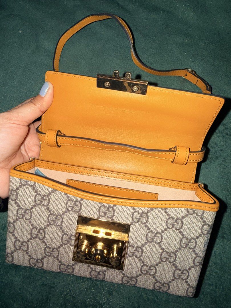 Gucci Padlock GG Supreme Small Shoulder Bag (Category: Luxury Bags & Wallets) located in Manila. Submitted by _outofthecloset. (Listing ID 1467664799, Image 3). Description: - Gucci Padlock shoulder bag - GG Supreme canvas with chic white leather flap top and tan leather trim - Elegant gold-tone lock closure with engraved Gucci lettering - Clean neutral fabric interior with a convenient slip pocket - Condition: Very clean interior and exterior ov