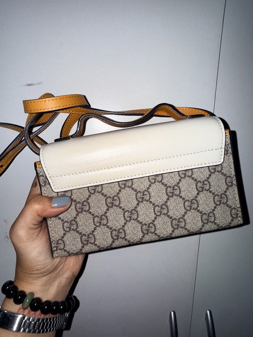 Gucci Padlock GG Supreme Small Shoulder Bag (Category: Luxury Bags & Wallets) located in Manila. Submitted by _outofthecloset. (Listing ID 1467664799, Image 2). Description: - Gucci Padlock shoulder bag - GG Supreme canvas with chic white leather flap top and tan leather trim - Elegant gold-tone lock closure with engraved Gucci lettering - Clean neutral fabric interior with a convenient slip pocket - Condition: Very clean interior and exterior ov