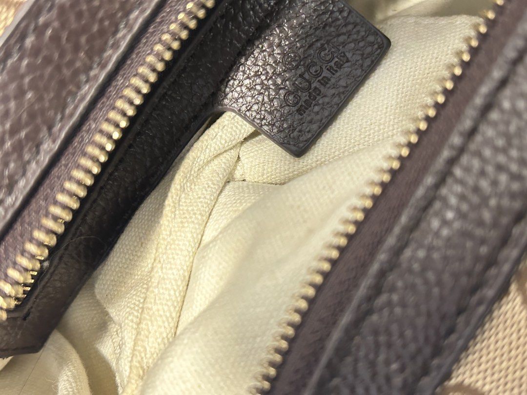 Gucci Sukey Bag (Category: Luxury Bags & Wallets) located in Bulacan. Submitted by blondetrack14 (Listing ID 1467785613, Image 2). Description: - NGA Gucci brown monogram canvas handbag - Premium leather trim and dual top handles - Secure top zip closure - Features iconic interlocking GG charm on front ring - Clean light fabric interior with embossed Gucci 'Made in Italy' leather tag - Includes matching detachable strap - Condition: Excellent / W