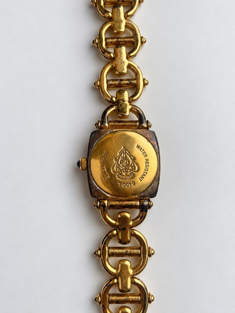 Gucci Vintage Horsebit 6400L (Category: Women's Watches) located in Iguig. Submitted by love_thaalliah (Listing ID 1467629800, Image 2). Description: Selling one of my personal collections. Please see photos for the issue of the watch. Still working in very good condition. - Authentic vintage Gucci Swiss-made quartz watch - Distinctive square white dial with engraved bezel branding - Elegant gold-tone link bracelet strap with crown featuring a da