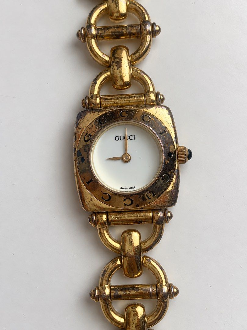 Gucci Vintage Horsebit 6400L (Category: Women's Watches) located in Iguig. Submitted by love_thaalliah (Listing ID 1467629800, Image 1). Description: Selling one of my personal collections. Please see photos for the issue of the watch. Still working in very good condition. - Authentic vintage Gucci Swiss-made quartz watch - Distinctive square white dial with engraved bezel branding - Elegant gold-tone link bracelet strap with crown featuring a da