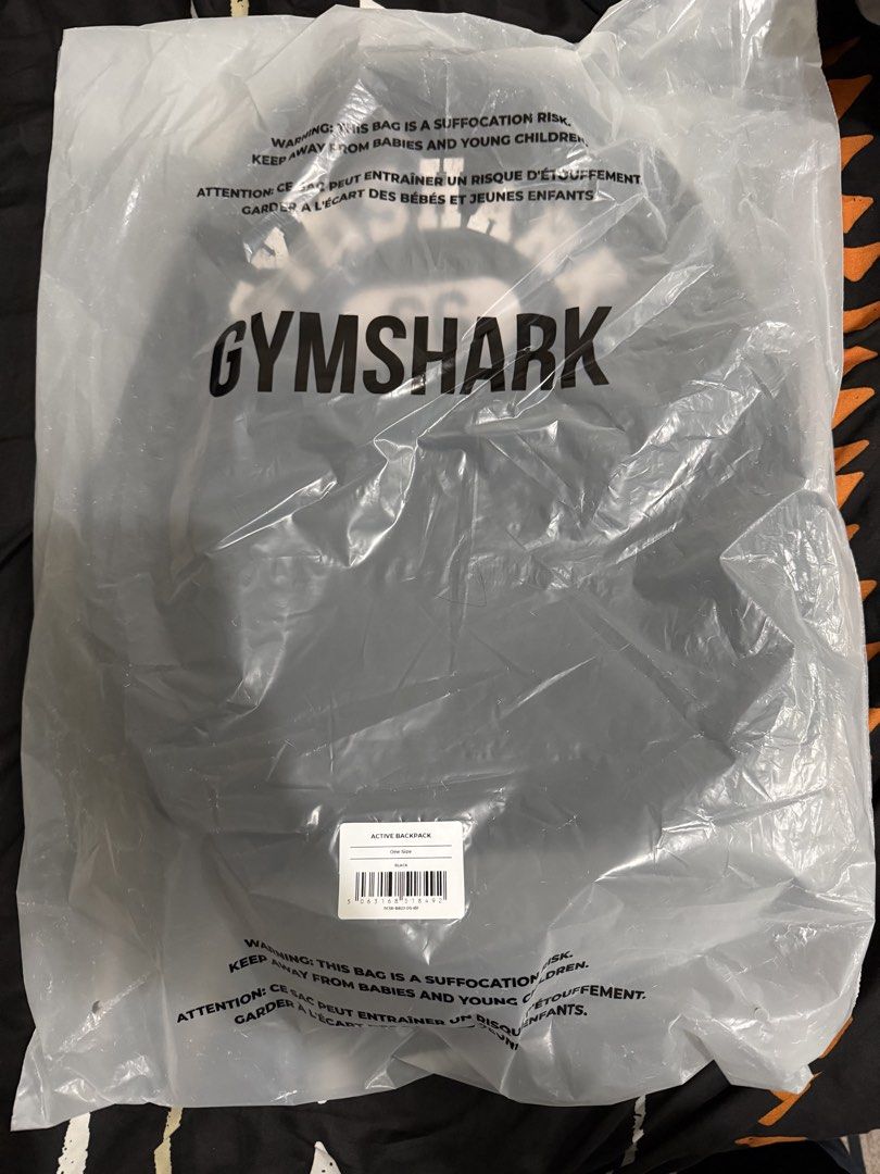 Gymshark Active Backpack (Category: Backpacks) located in Quezon City. Submitted by kentivan21 (Listing ID 1467704374, Image 1). Description: - Brand: Gymshark Active Backpack - Color: Classic Black - Condition: Brand new, unopened, still in original plastic bag with barcode tag attached - Size: One size fits all - Features: Heavy-duty material, spacious main compartment, extra storage pockets, and padded straps for comfort - Ideal for: Gym sessi