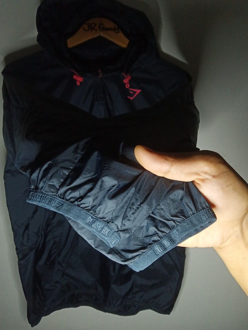 Gymshark Black Windbreaker Jacket Size M (Category: Activewear) located in Tanay. Submitted by jrgoods (Listing ID 1467661559, Image 3). Description: Gymshark windbreaker Medium Dimes: 21/26 Good as new condition 999+ship Tanay Rizal location Shipping Nationwide - Item: Pullover windbreaker jacket - Color: Black with vibrant bright pink accents Medium tag printed inside collar - Material: 100nylon shell - Features: Quarter zip front, attached hoo