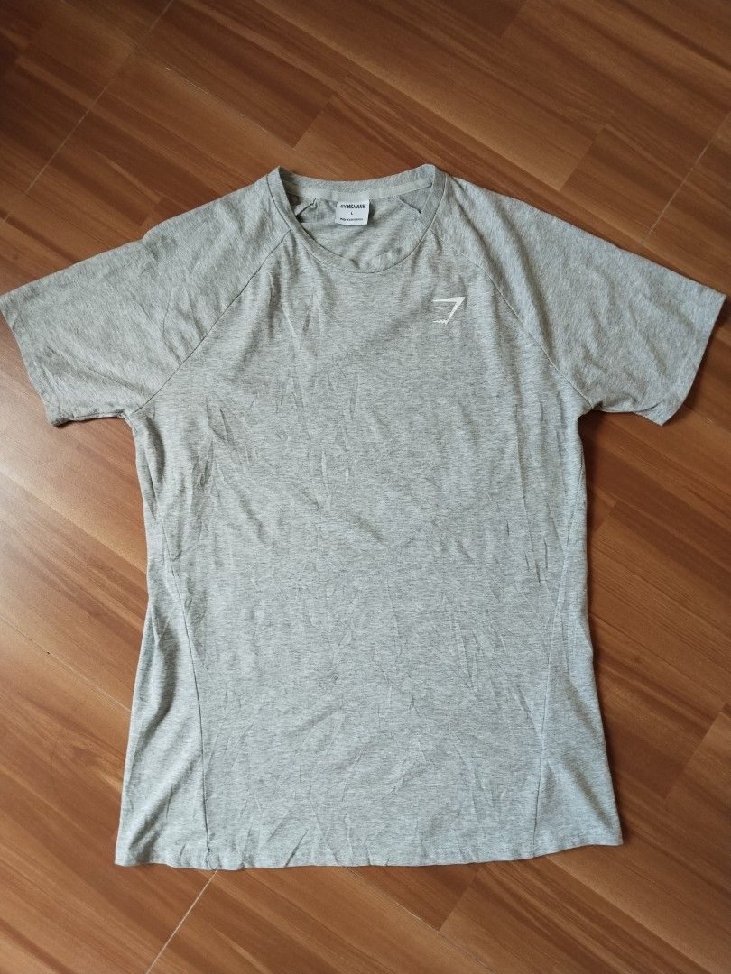 Gymshark Essential Logo Tee — Size L (Category: Tshirts & Polo Shirts ) located in Mabalacat. Submitted by al_amin_thrift (Listing ID 1467650737, Image 1). Description: Gymshark Essential Logo Tee — Size L 28*21 ✔️ Brand: Gymshark — authentic activewear ✔️ Size: L — regular athletic fit ✔️ Light heather grey — versatile everyday color ✔️ Soft stretch fabric — 57% cotton blend ✔️ Raglan sleeves + subtle chest logo ✔️ Excellent pre-loved condition 